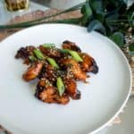 A plate of red korean popcorn chicken drumlets