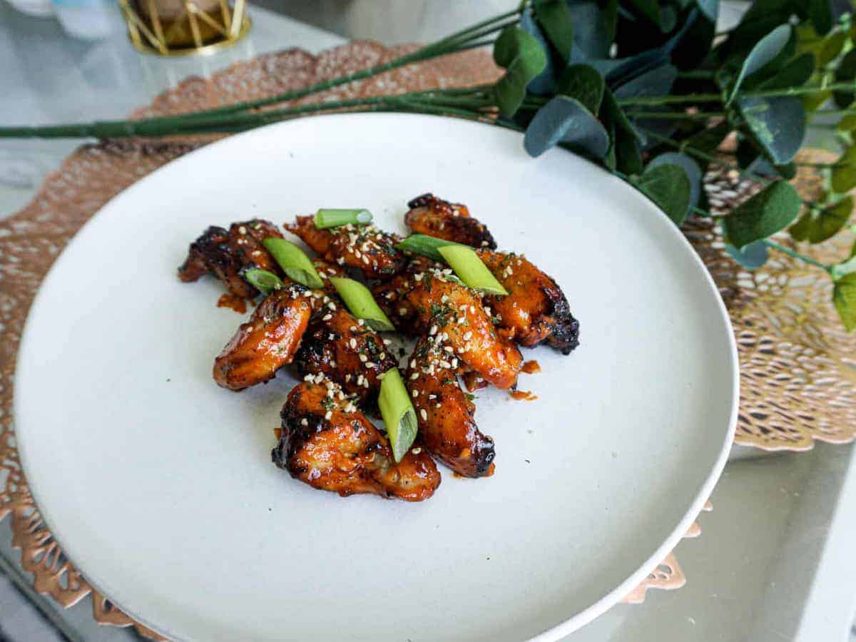 A plate of red korean popcorn chicken drumlets