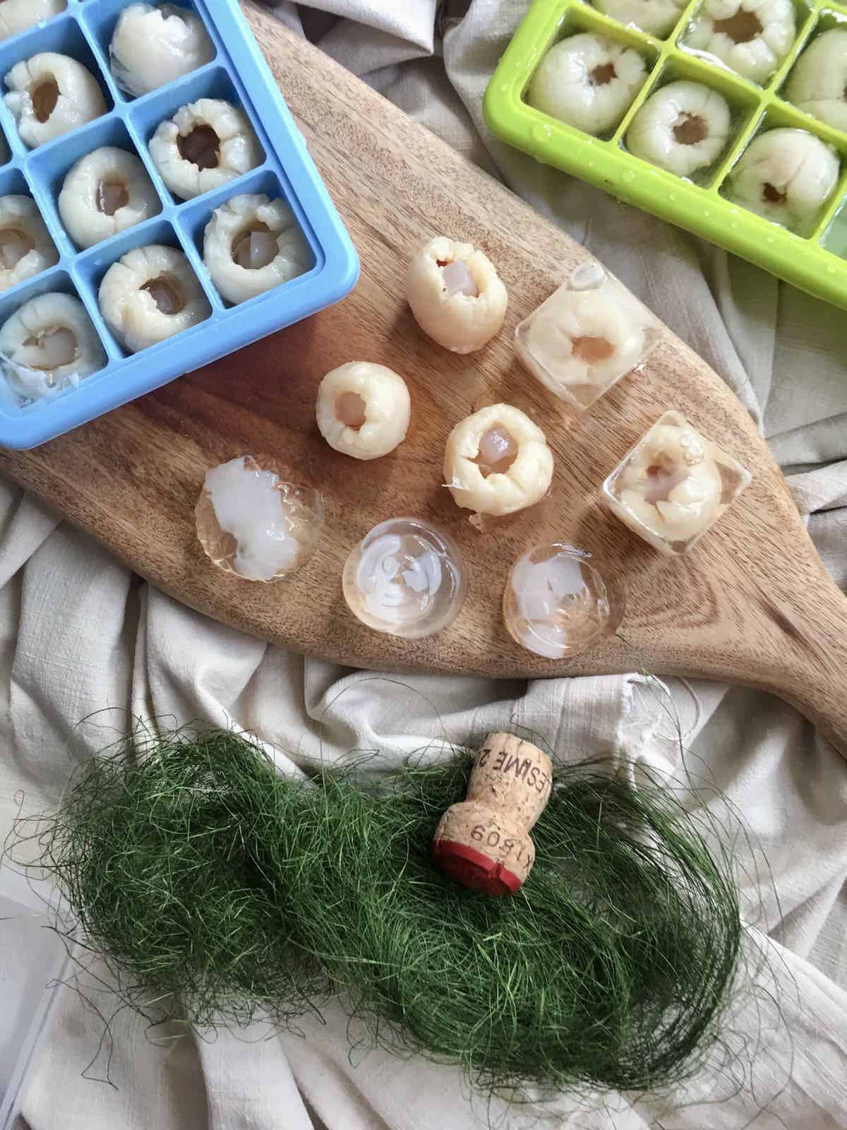 A variety of champagne lychee jellies on a serving board.