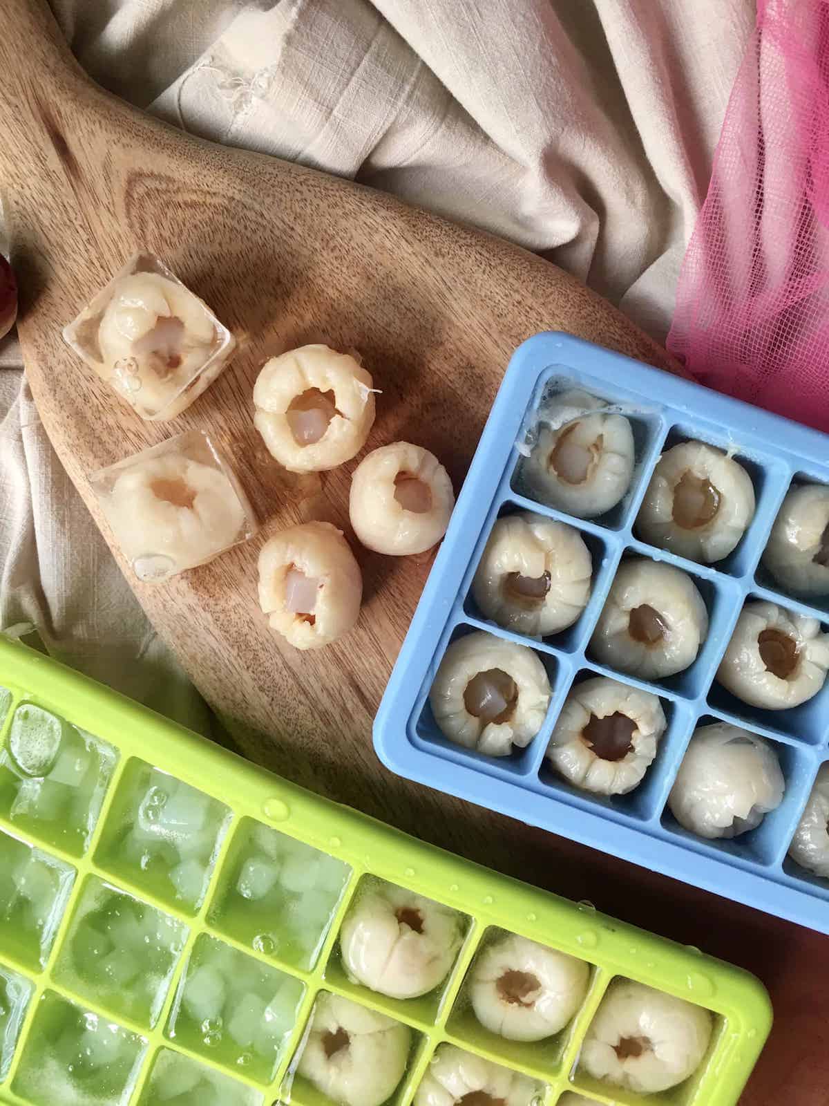 Bite sized lychee jellies with champagne, many still in their silicone moulds.