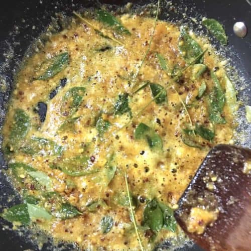 Bubbling salted egg yolk sauce in a pan.