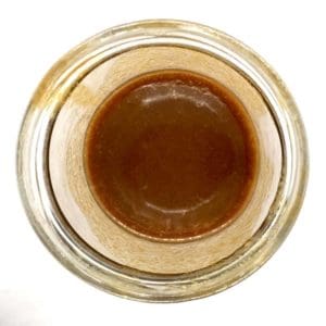 A jar of thick creamy and delicious vegan salted coconut caramel