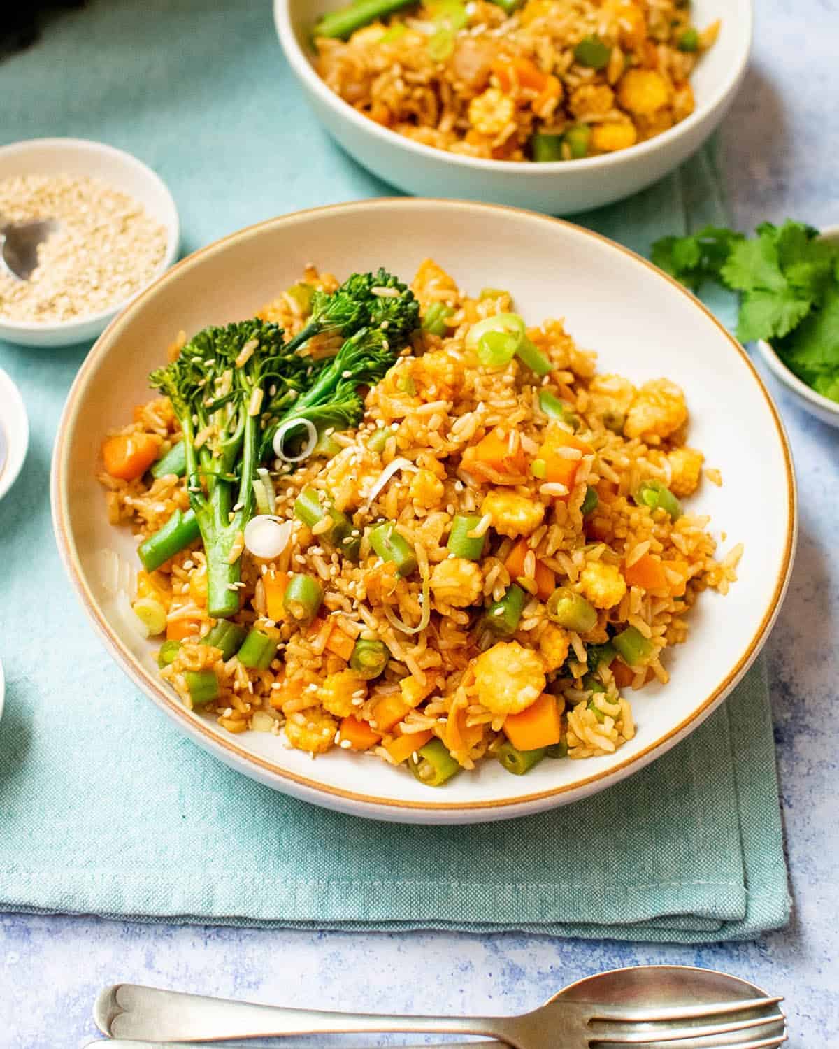 Vegan kimchi rice on an aqua place mat