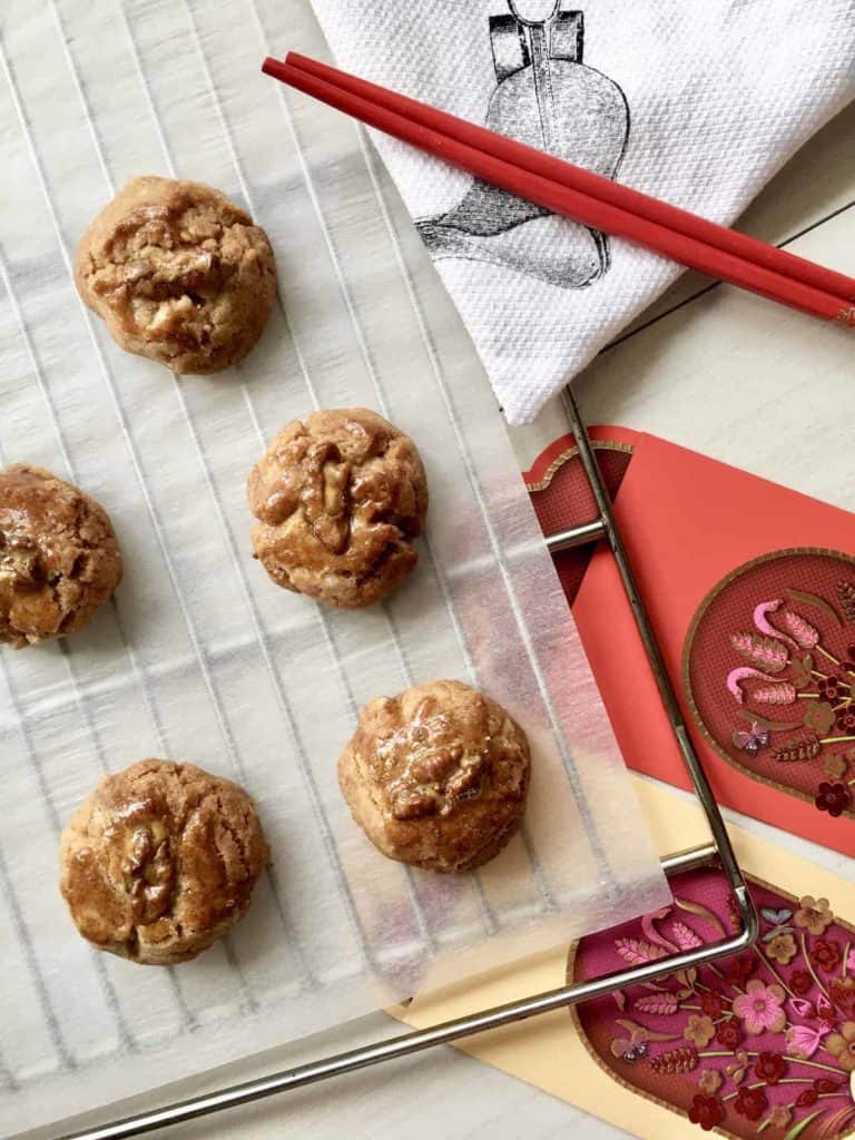 Cantonese walnut cookies for Chinese New Year with red packets