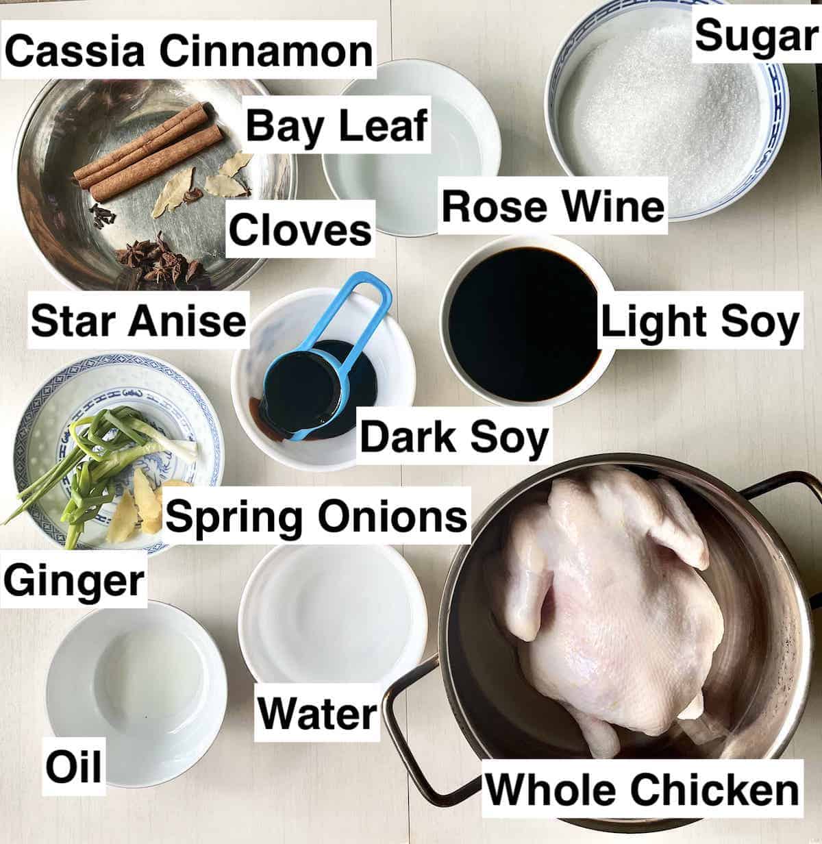 The ingredients for cantonese soy sauce chicken in bowls next to each other.