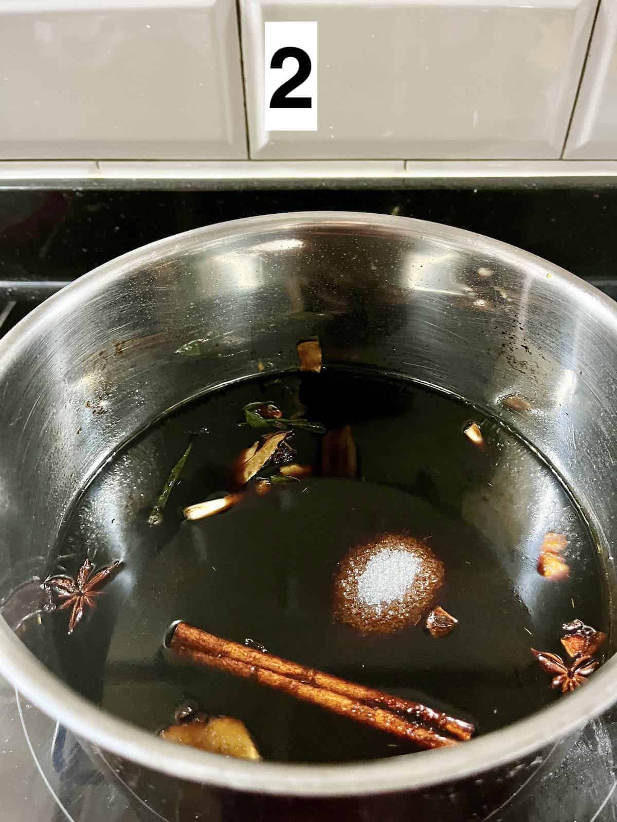 Dissolving sugar in a soy sauce poaching liquid.