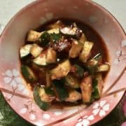 Close-up of red spicy asian cucumber salad.