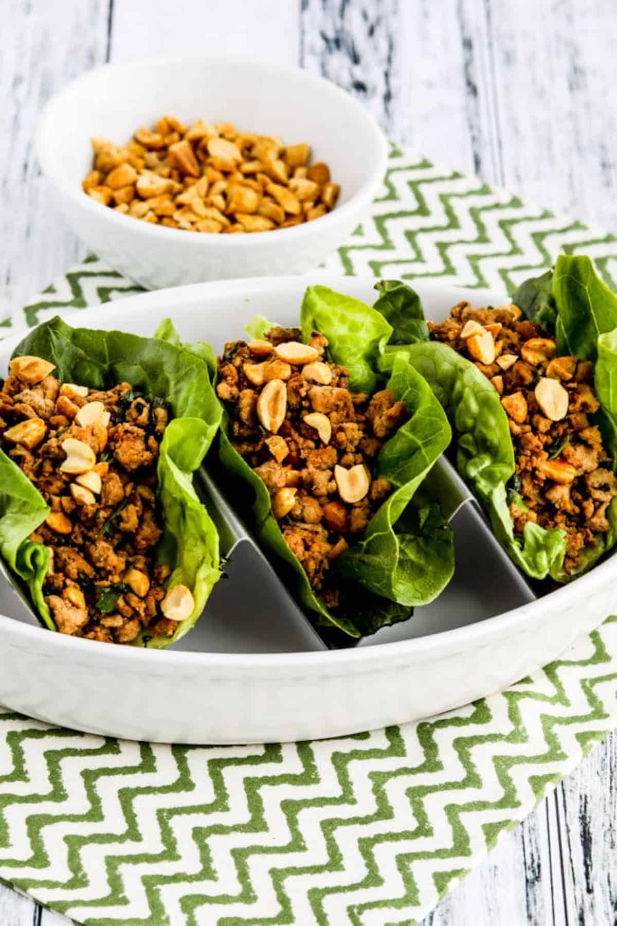 3 lettuce cups filled with ground turkey and mushrooms.