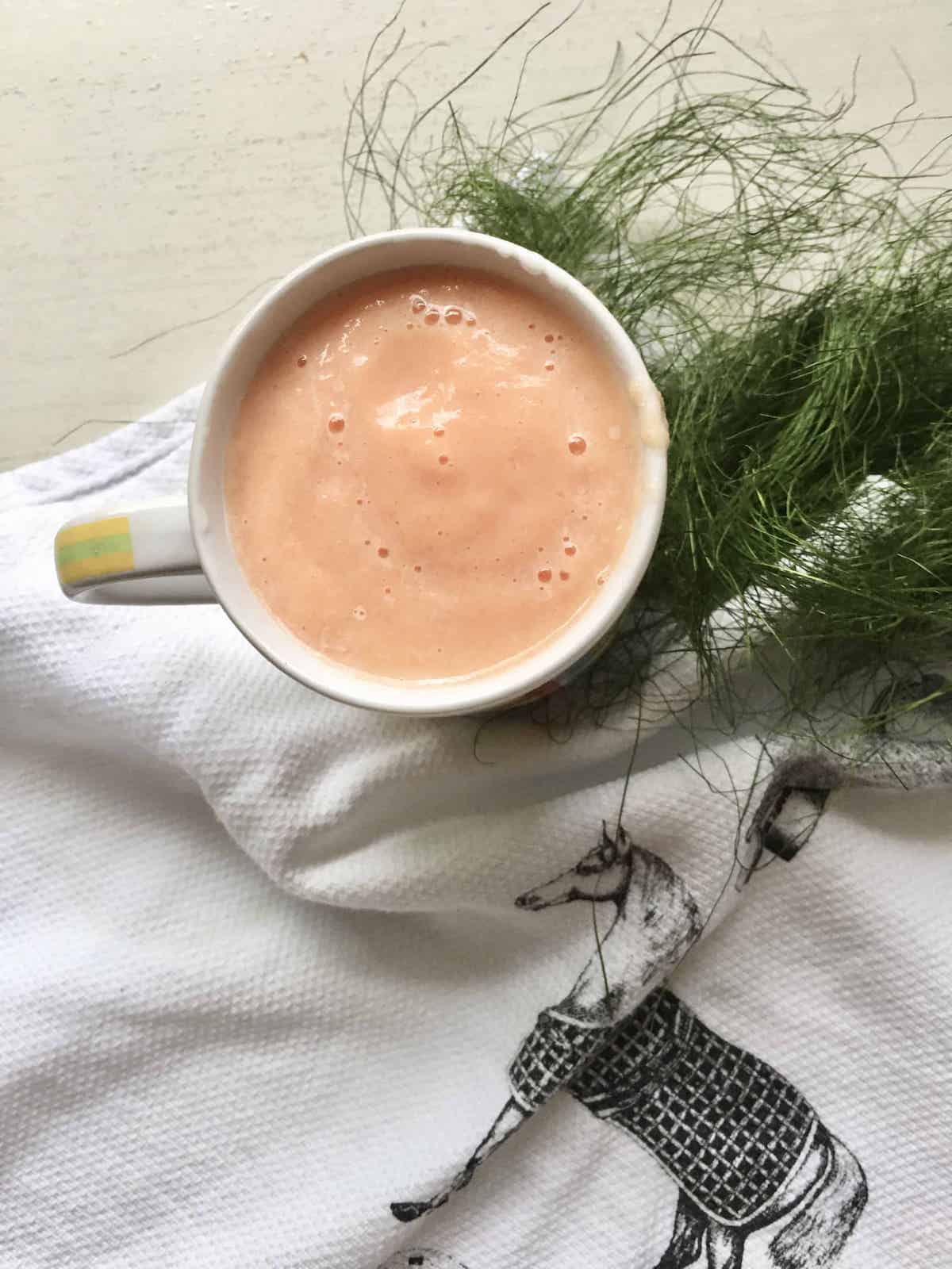 A mug of papaya blended with milk