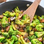 Close-up of broccoli and mushrooms in a skillet.