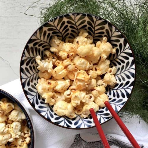 A bowl of spicy popcorn popped in LaoGanMa chill crisp oil.