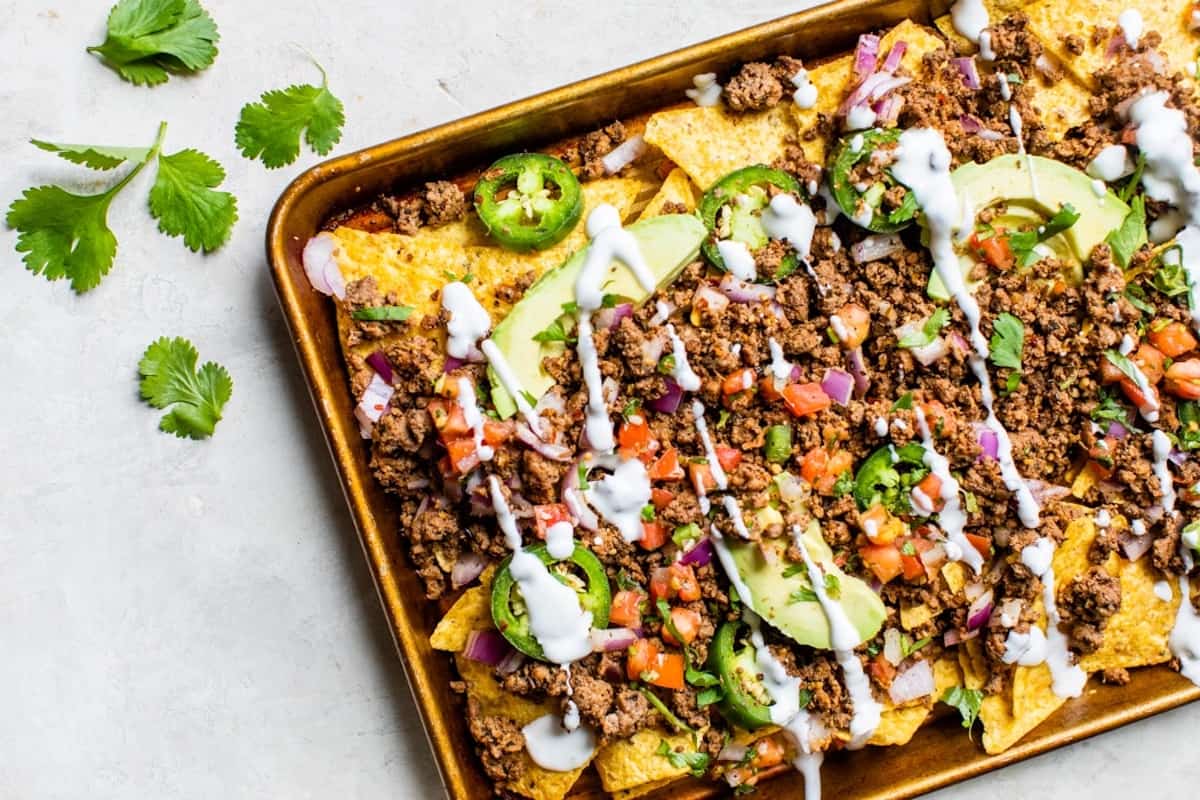 A huge tray of loaded nachos