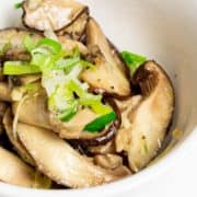 Close-up of stir-fried shiitake mushrooms.