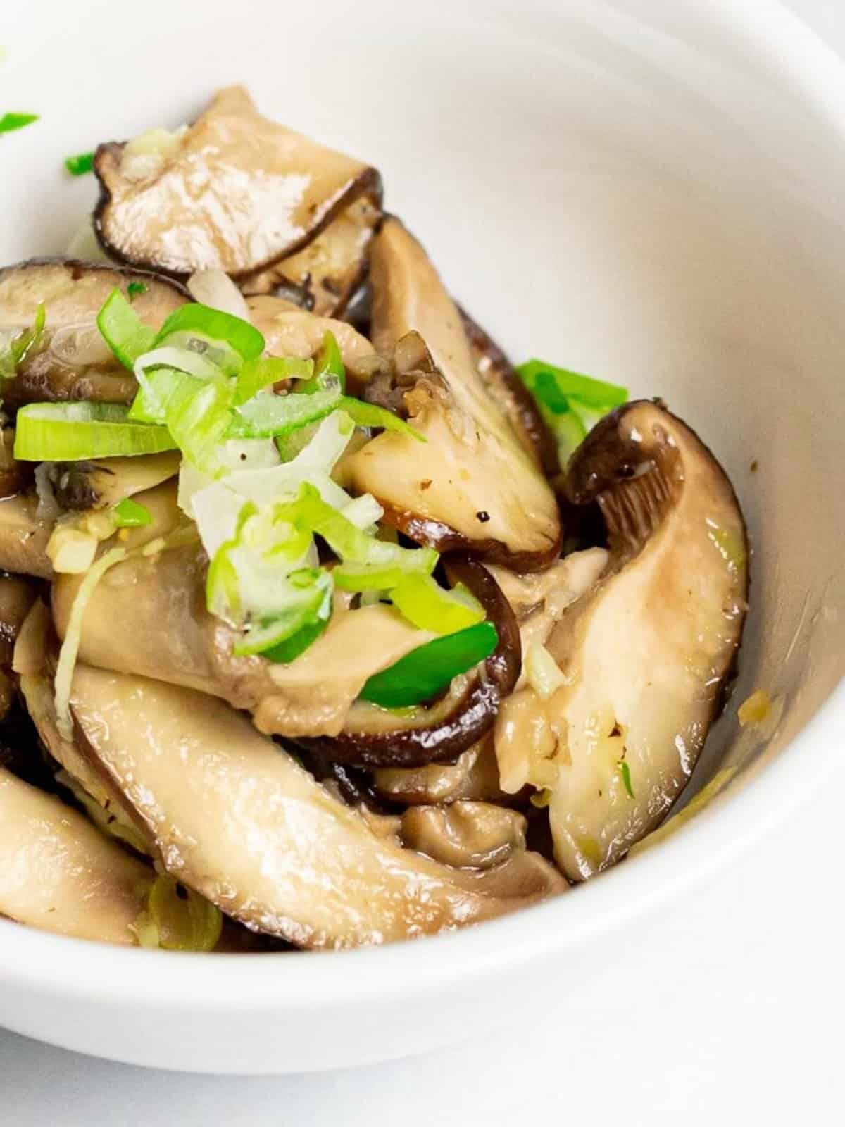 Close-up of stir-fried shiitake mushrooms.