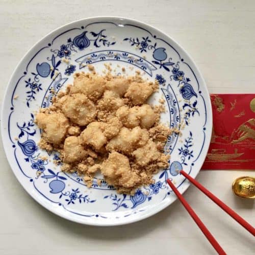A plate of homemade steamed muah chee, or Chinese mochi, coated with peanuts