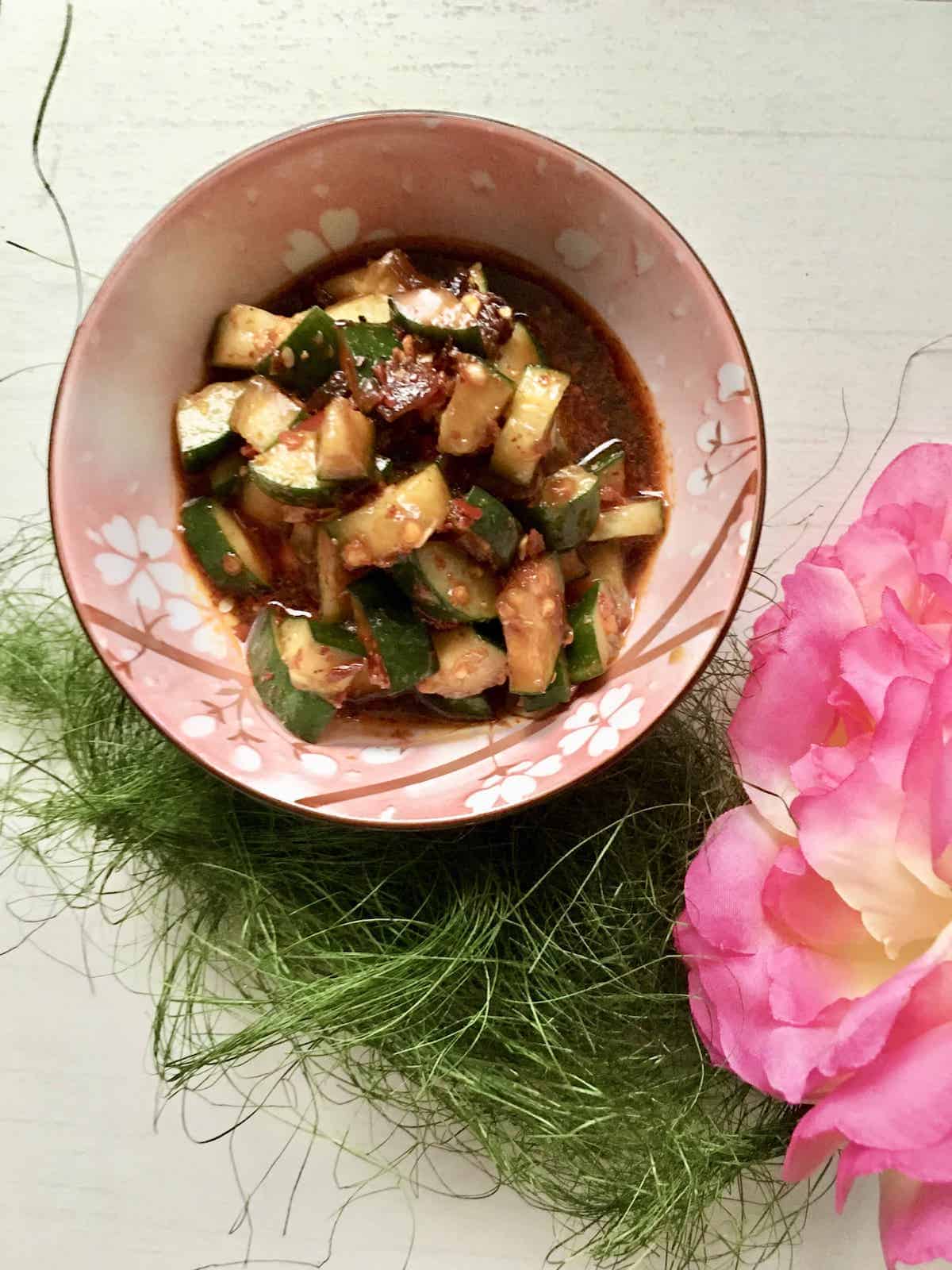 A bowl of spicy cold cucumber salad.