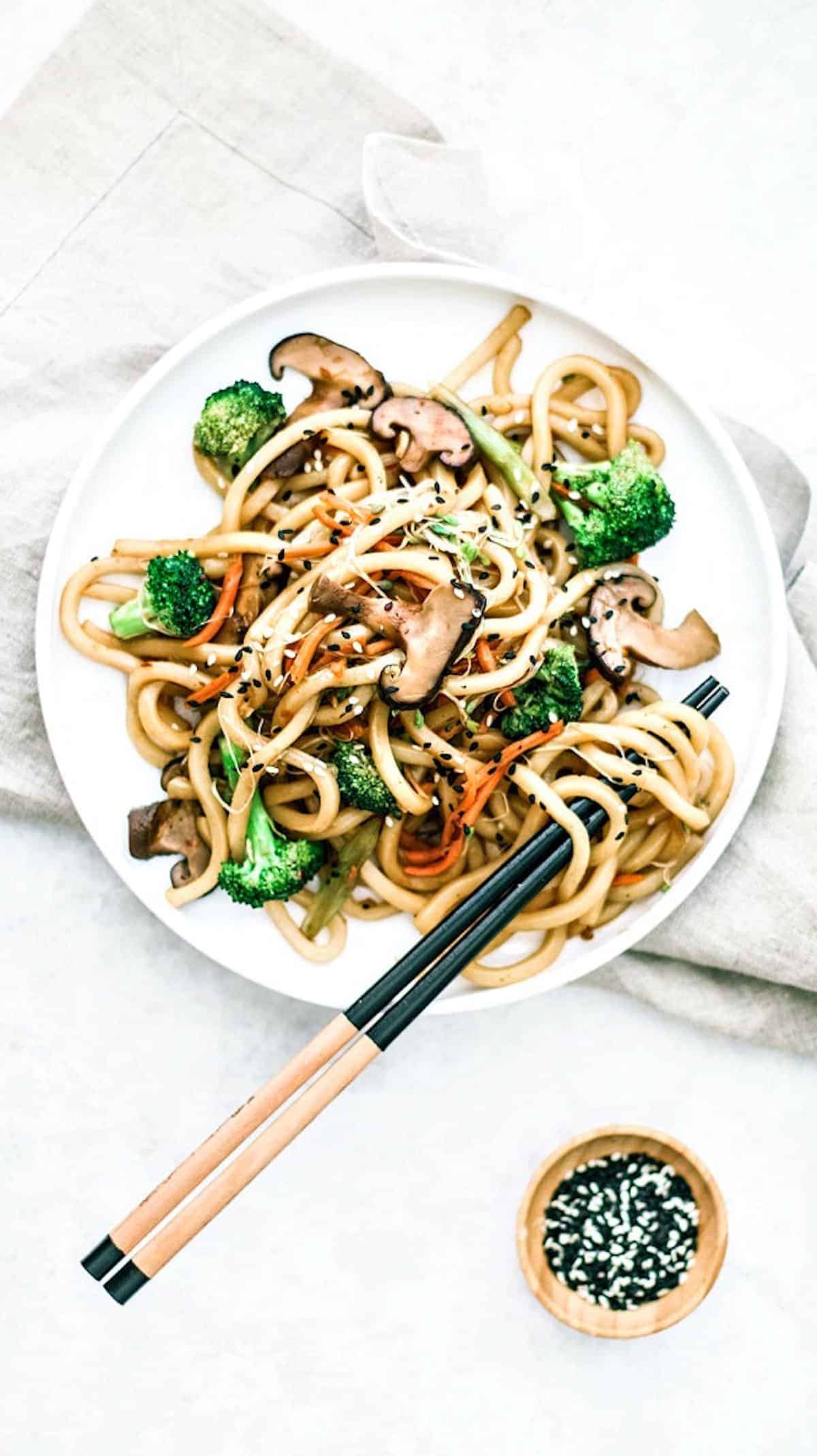 A plate of stir-fried Japanese udon noodles.