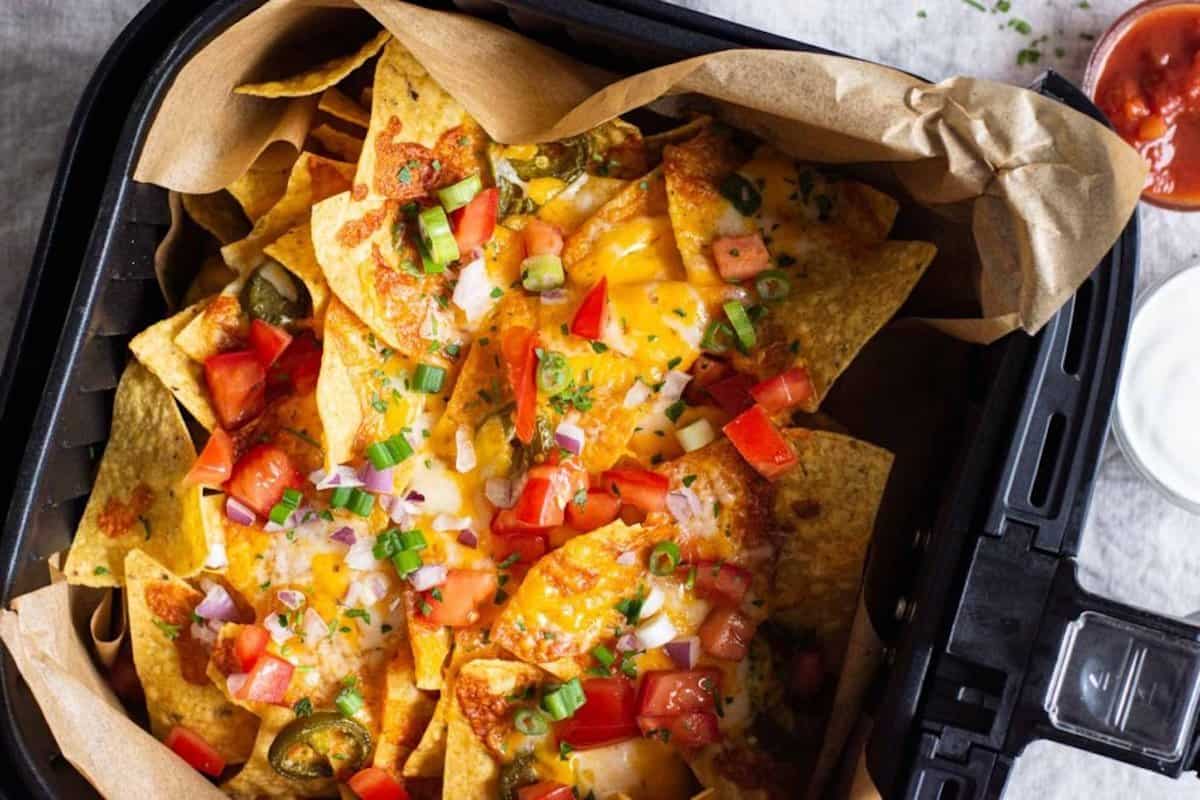 A close-up of nachos in an air fryer tray