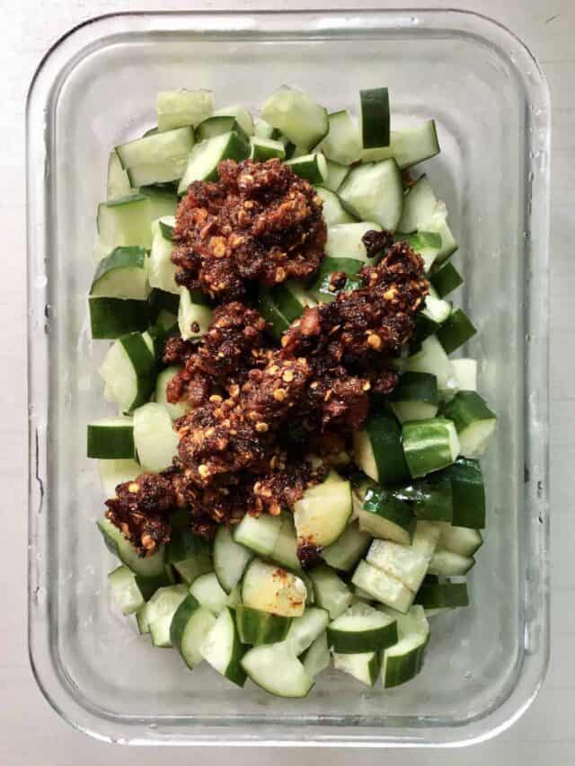 Cut cucumbers with chilli oil, soy sauce and vinegar heaped on top of them.