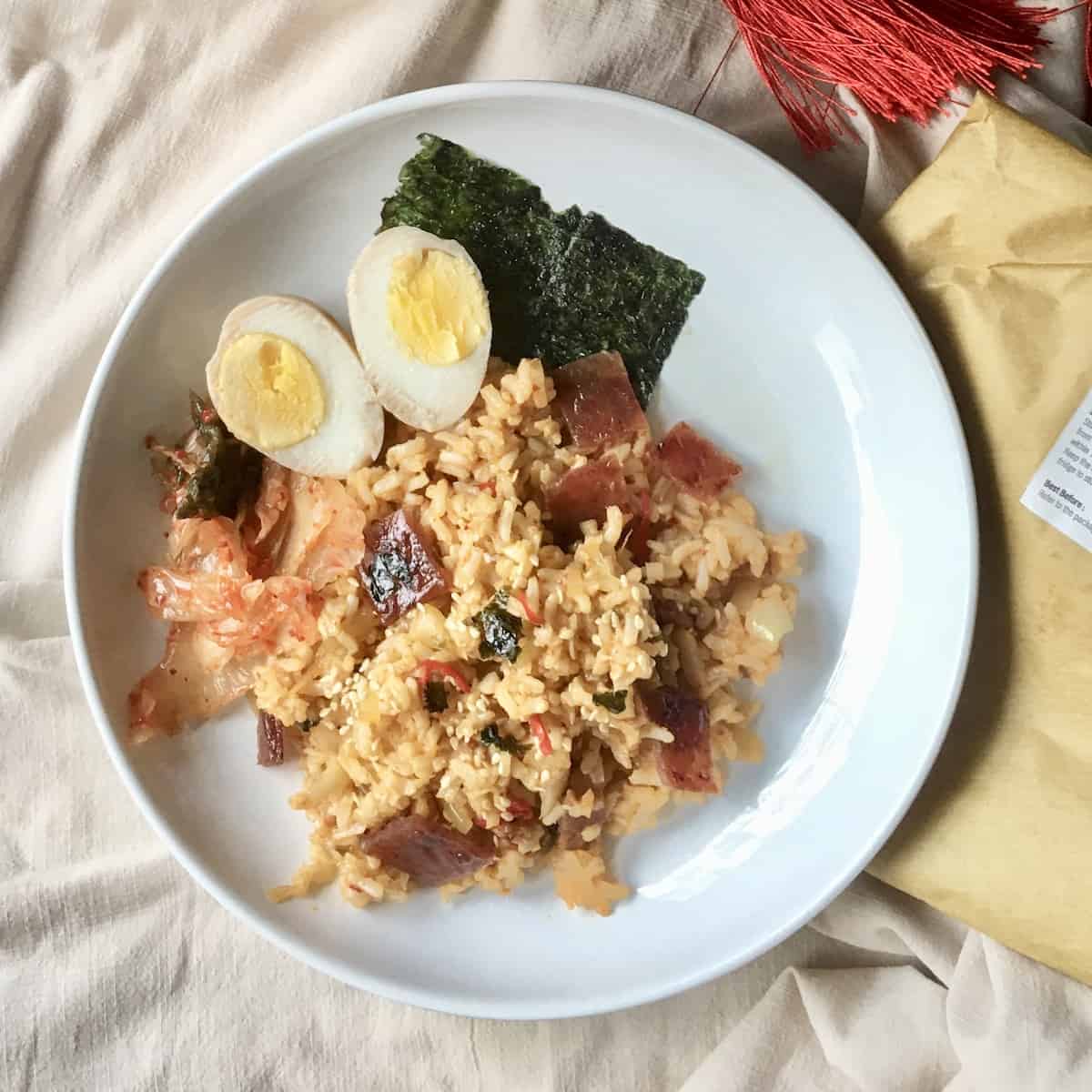 Close-up of kimchi fried rice with Chinese pork jerky and eggs.