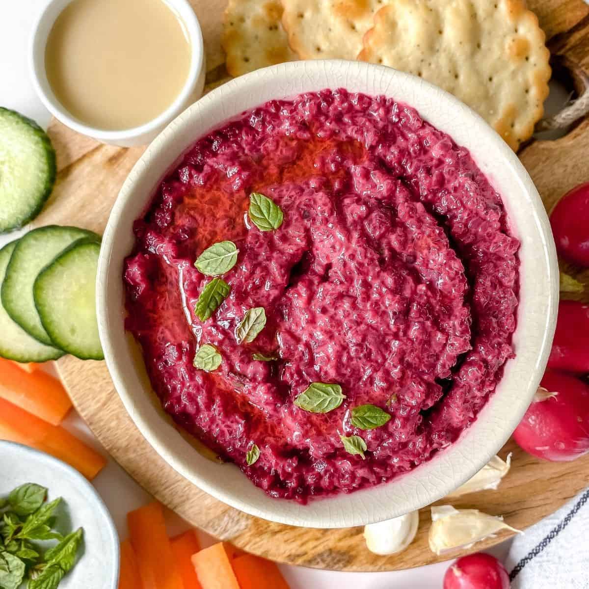 Close-up of a red dip made of roasted beetroot.