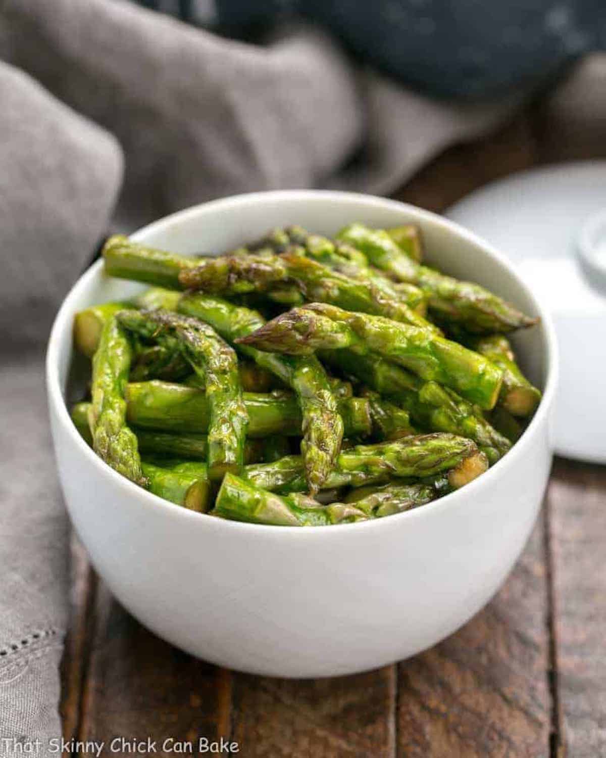 A bowl of stir-fried asparagus.