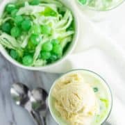 A bowl of Buko Pandan next to ice cream.