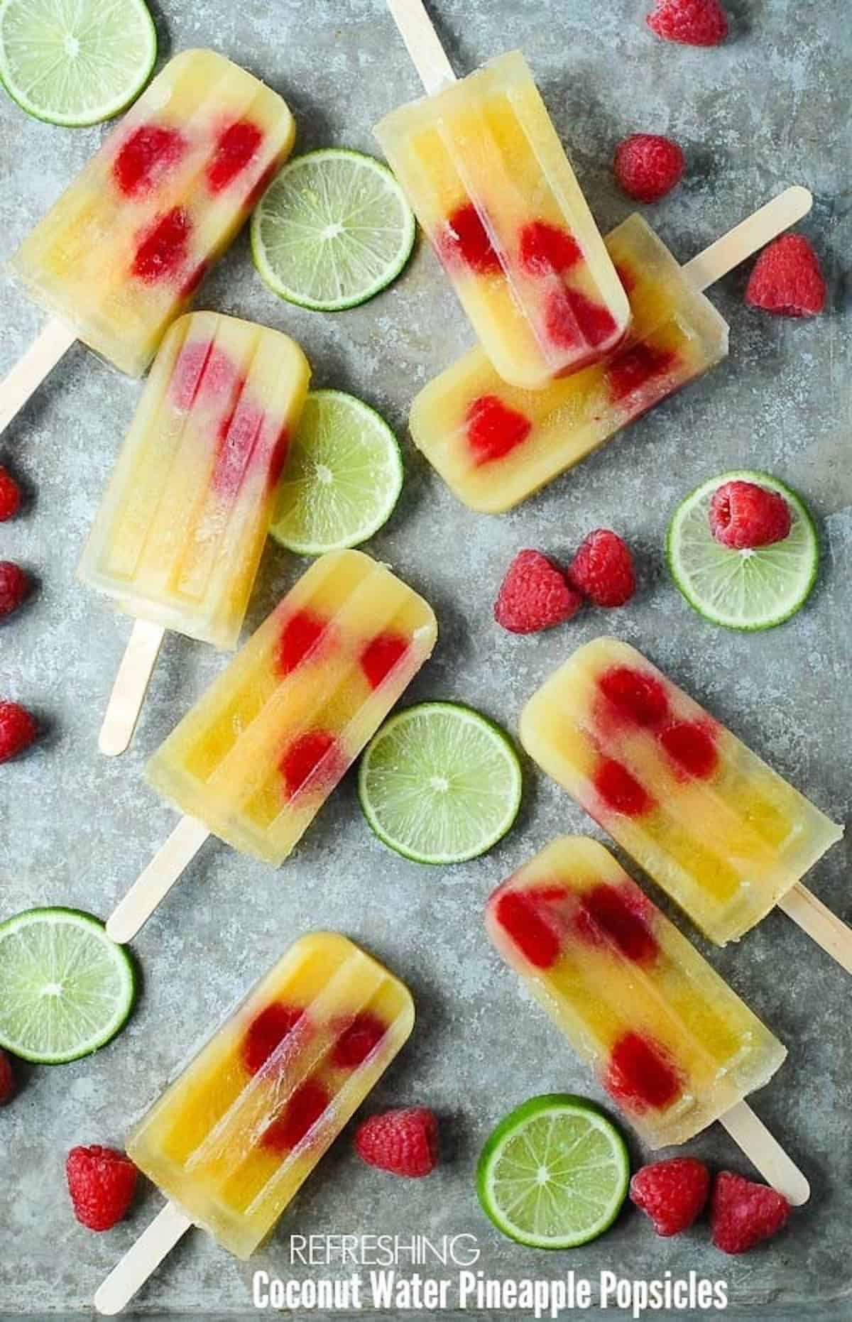 8 coconut water & pineapple popsicles lying flat.