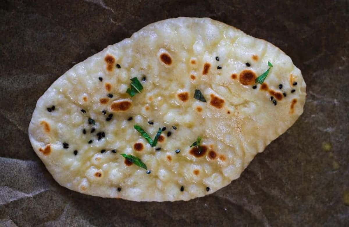 A piece of naan that was made on the stove.