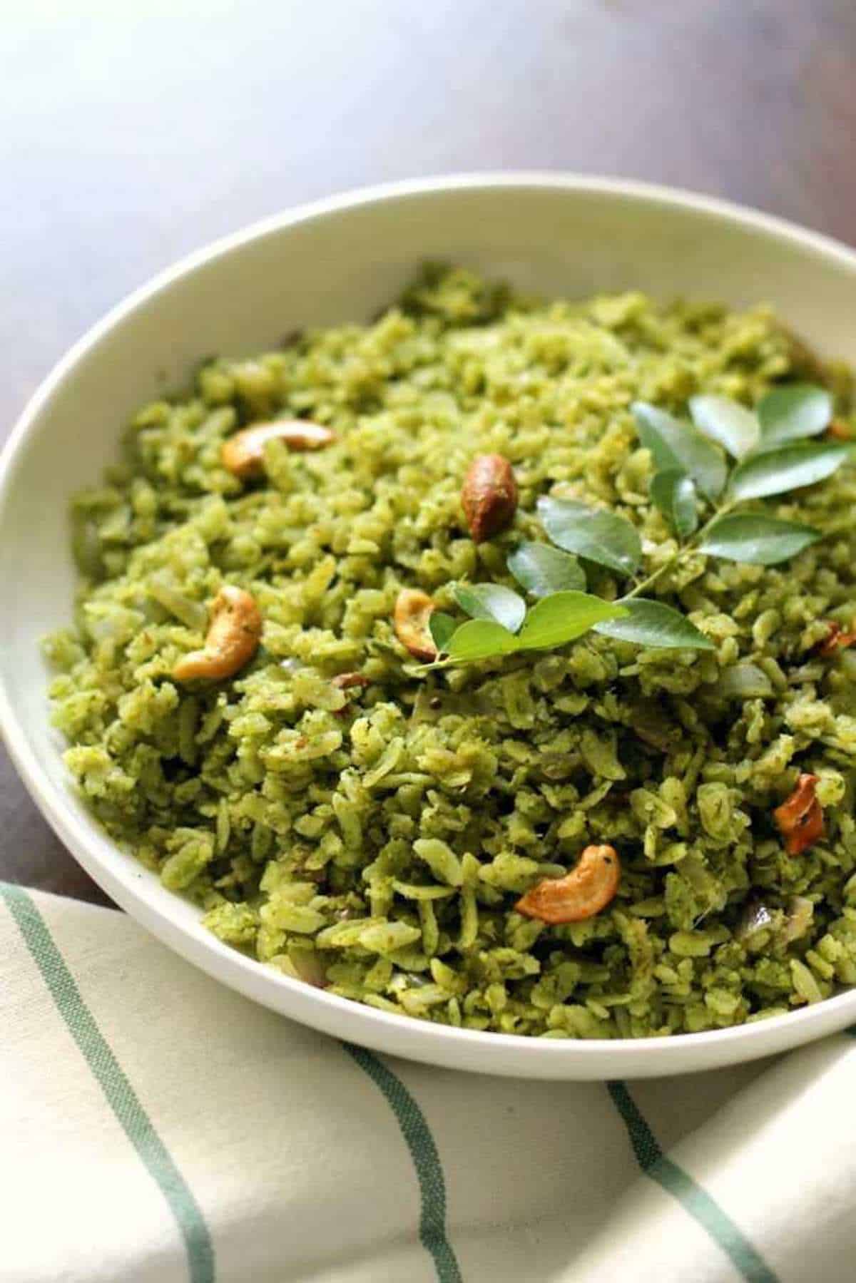 A plate of green Indian Poha rice.