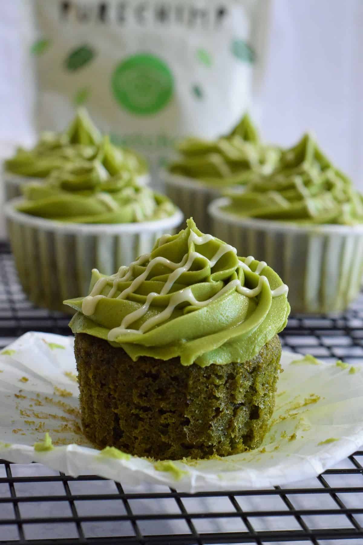 4 matcha cupcakes with green frosting.