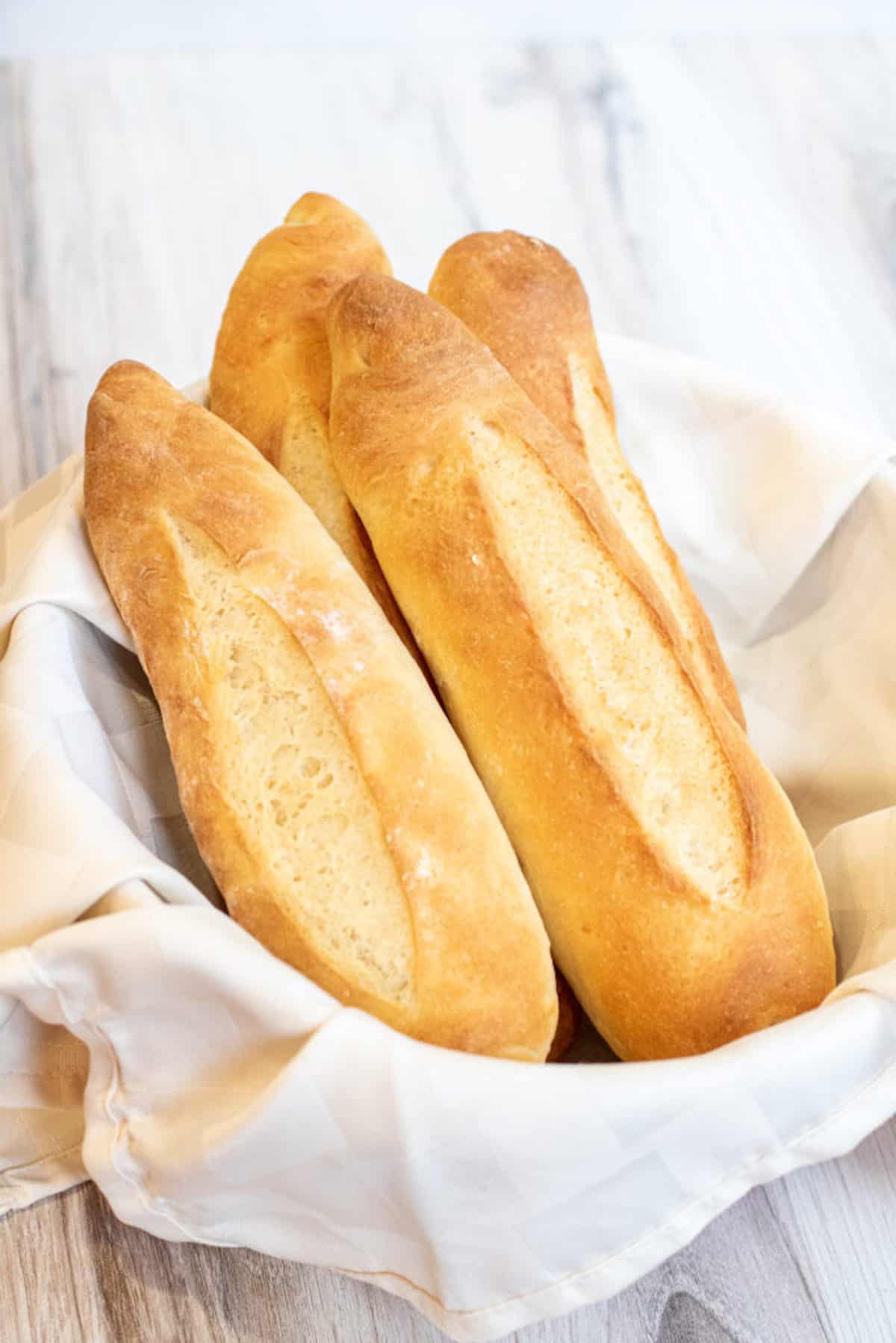 3 Vietnamese baguettes in a basket.