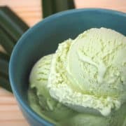 Close-up of a few scoops of light green pandan ice cream.