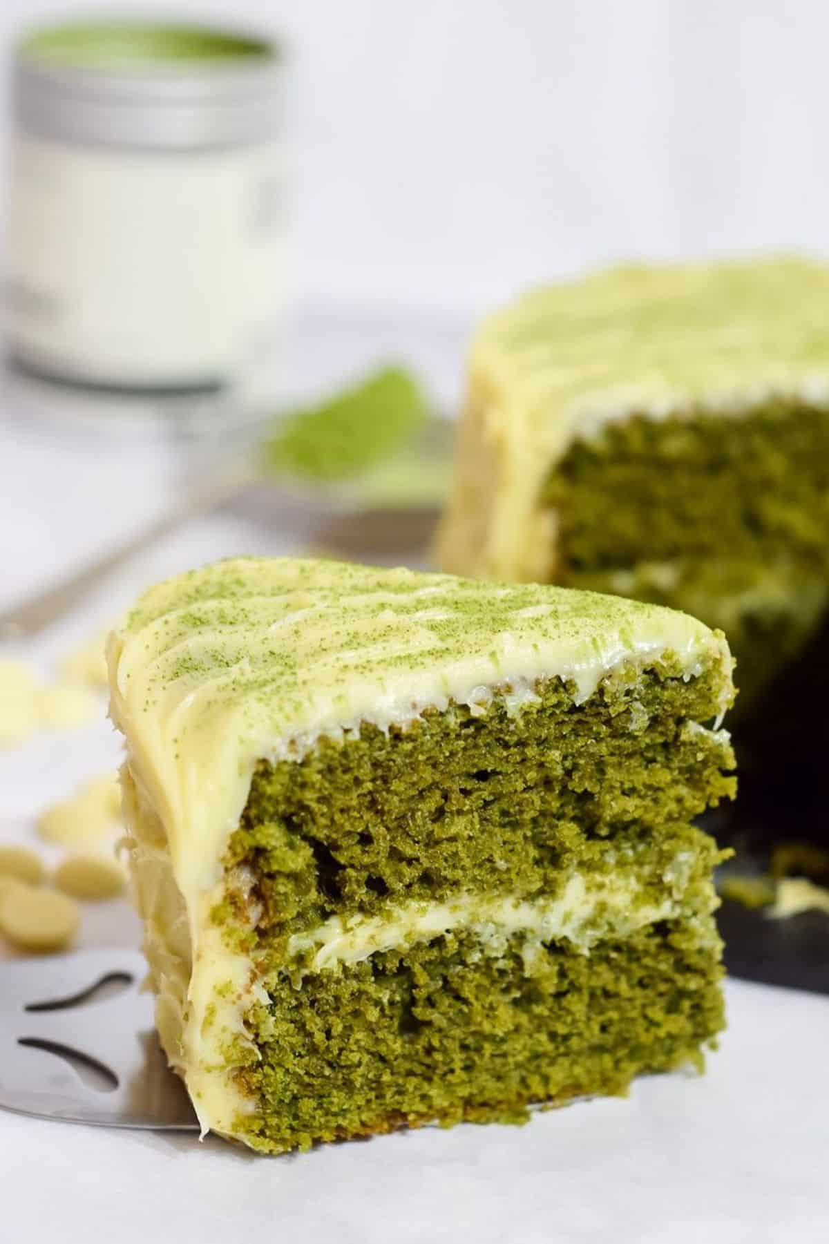 Close-up of a slice of matcha cake .