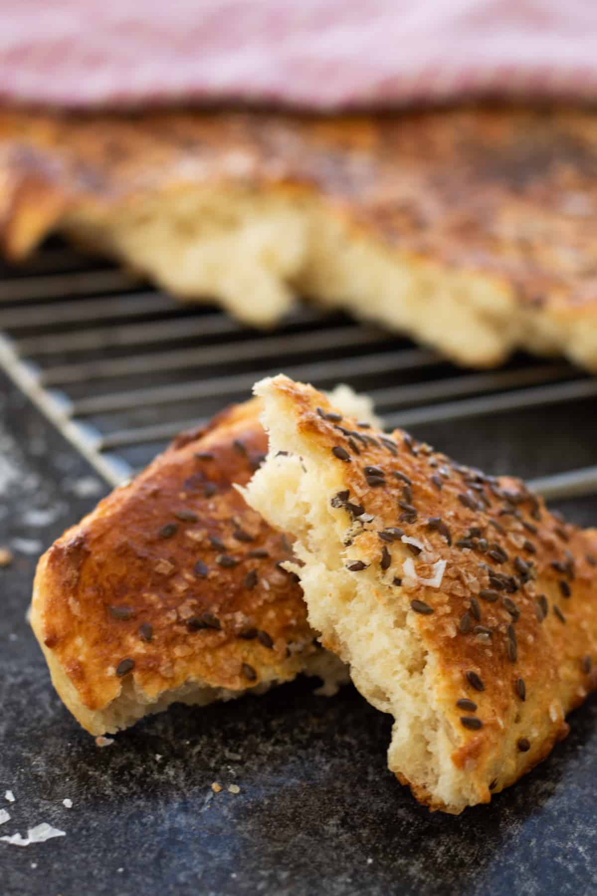 Slices of Turkish bread on a baking tray.