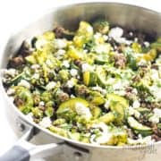 Close-up of zucchini & beef in a pan.