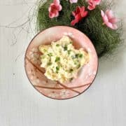 A bowl of Philadelphia cream cheese with egg, garlic and green chillies.