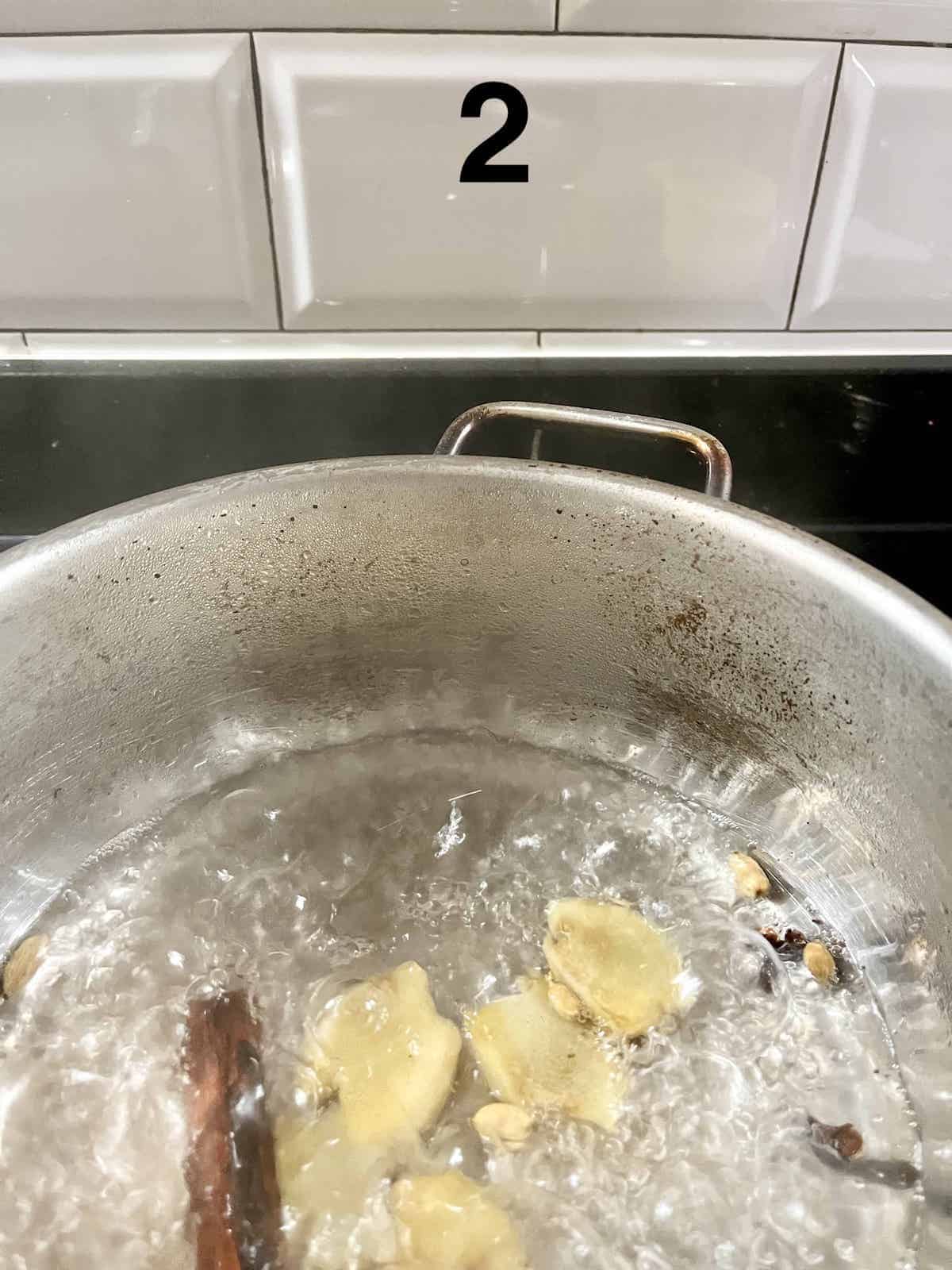 Boiling ginger, cinnamon, cloves and cardamom for Masala Chai Tea.