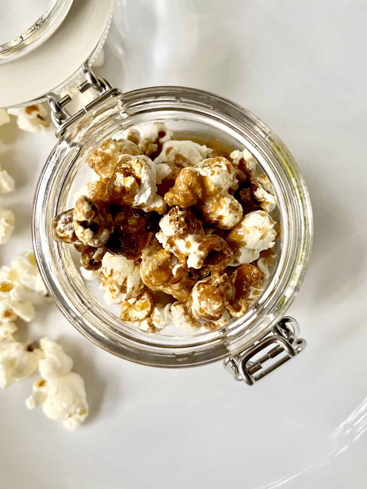 Close-up overheat shot of soy sauce popcorn in a. glass jar.