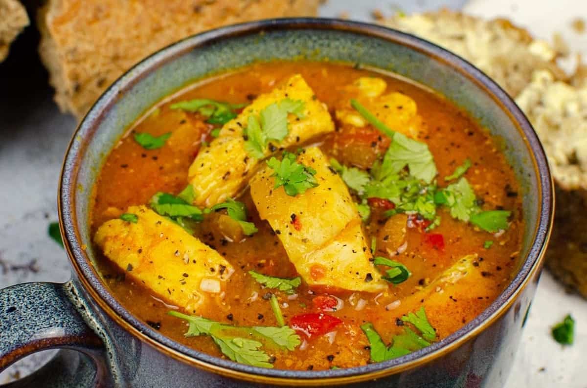 Close-up of spicy white fish soup with turmeric.