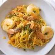 A plate of turmeric prawn linguini pasta.