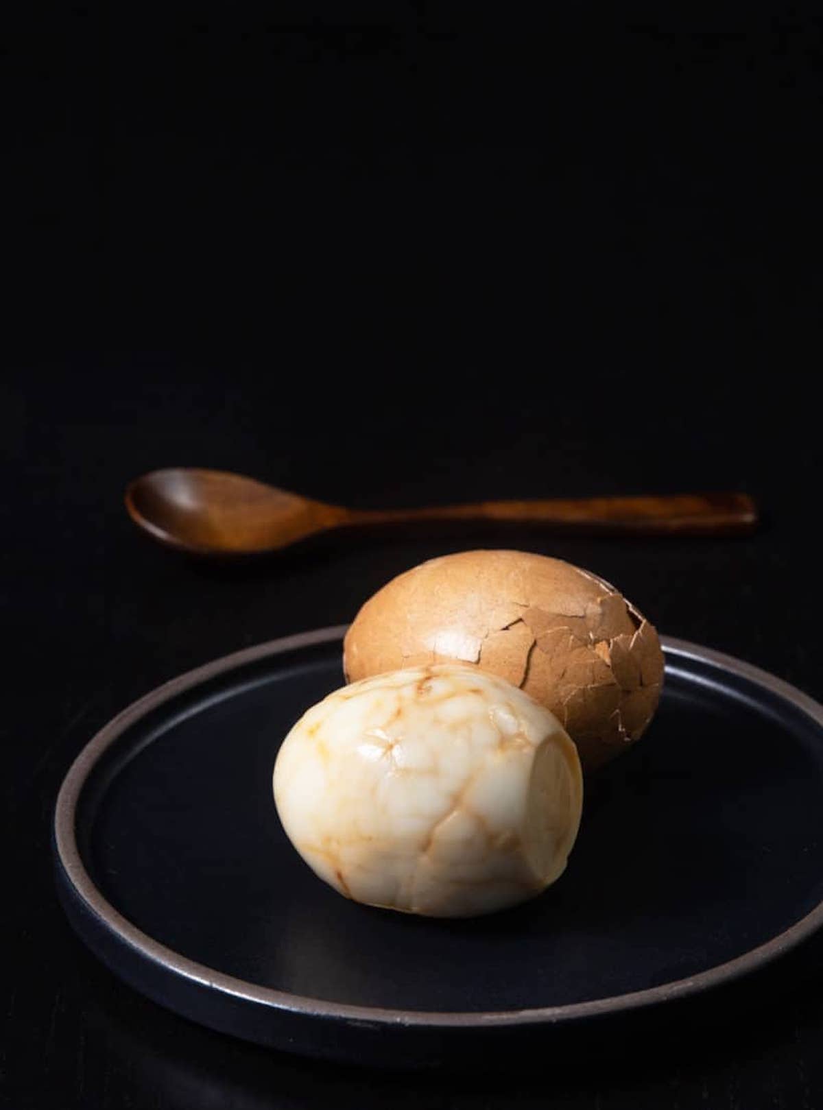 A moody side shot of a Taiwanese tea egg.