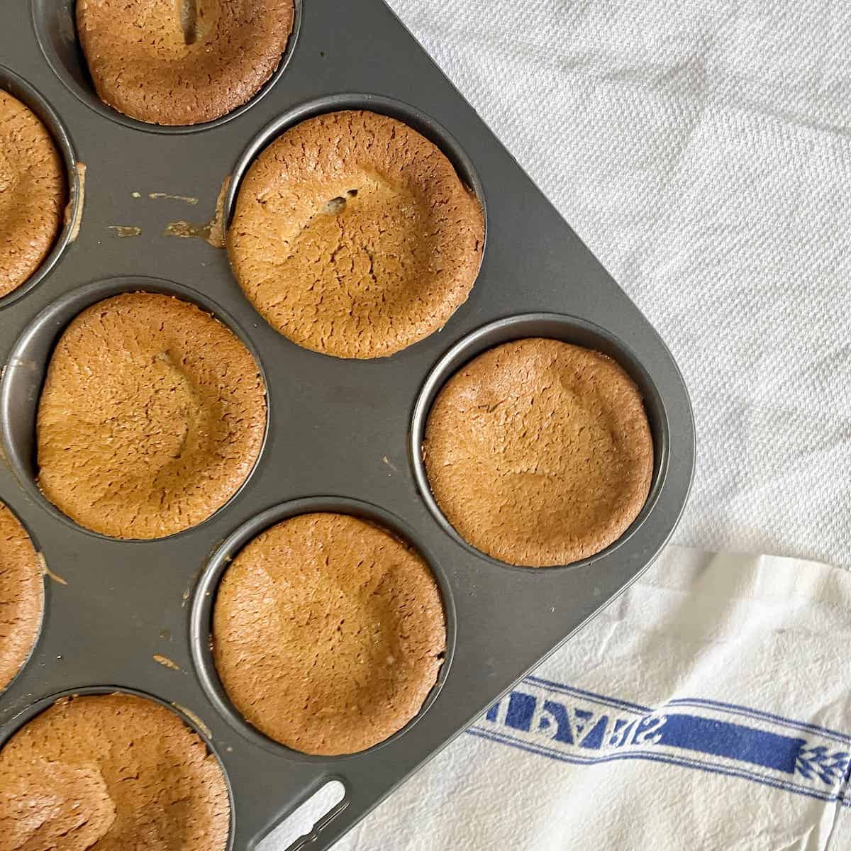 A tray of Japanese green tea mochi muffins fresh out of the oven.