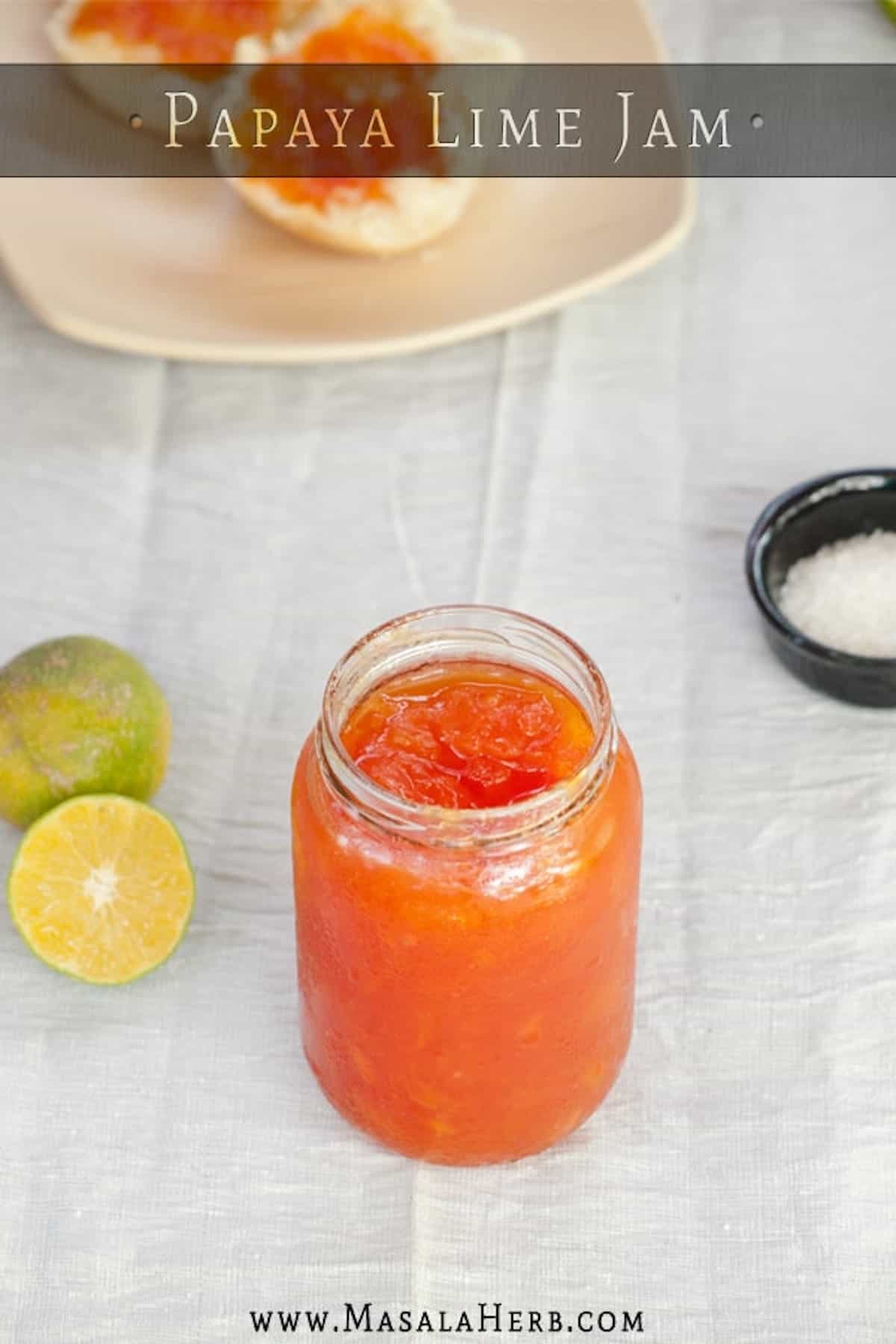 Orange papaya jam in a glass jar.