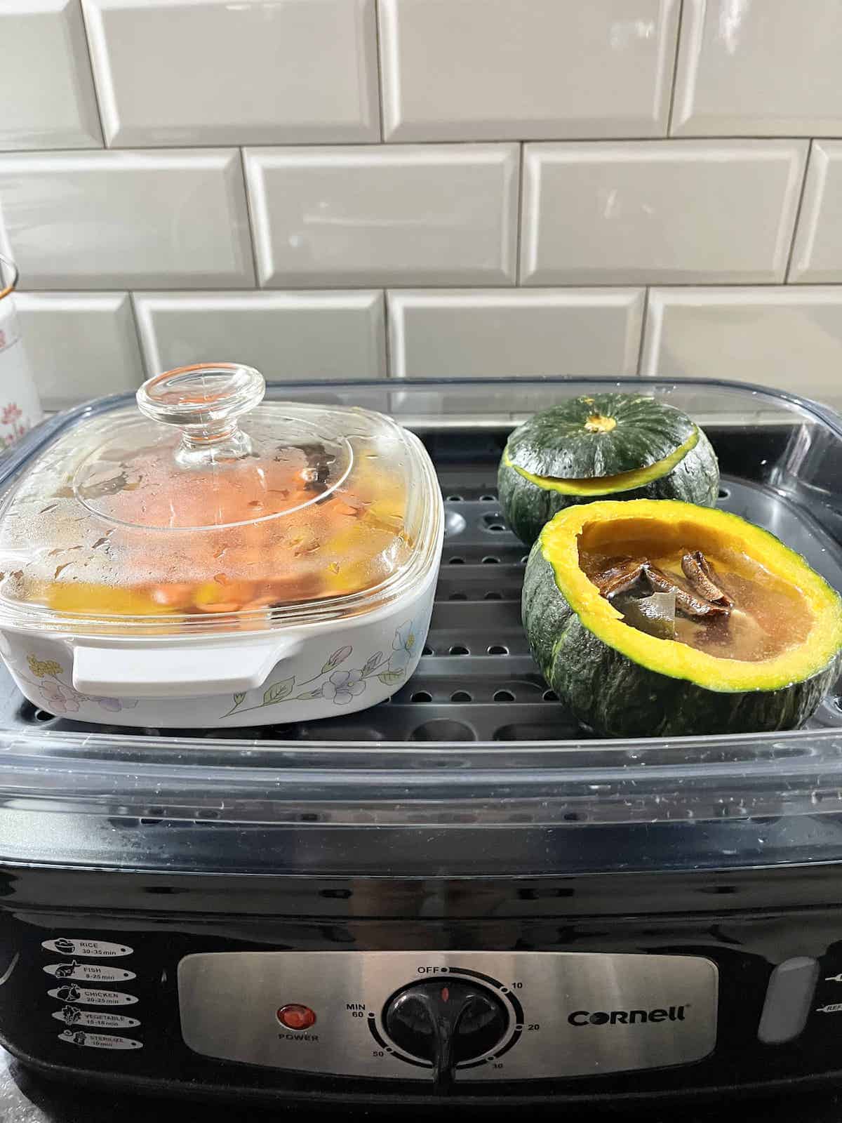 Chinese pumpkin soup being steamed in a tiered steamer.