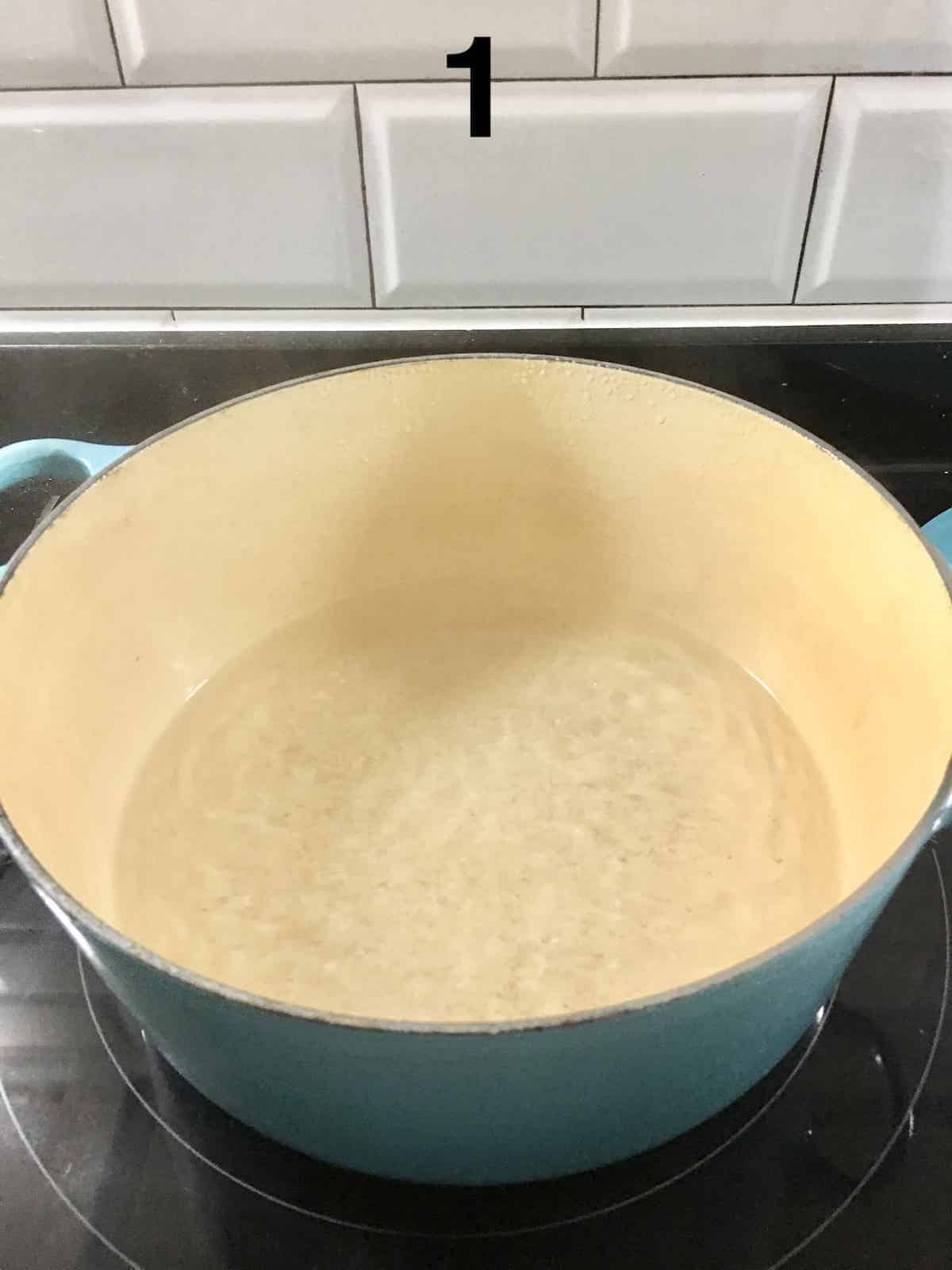 Water boiling in a large Le Creuset Dutch Oven,