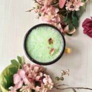 An overhead shot of green frothy pandan milk.