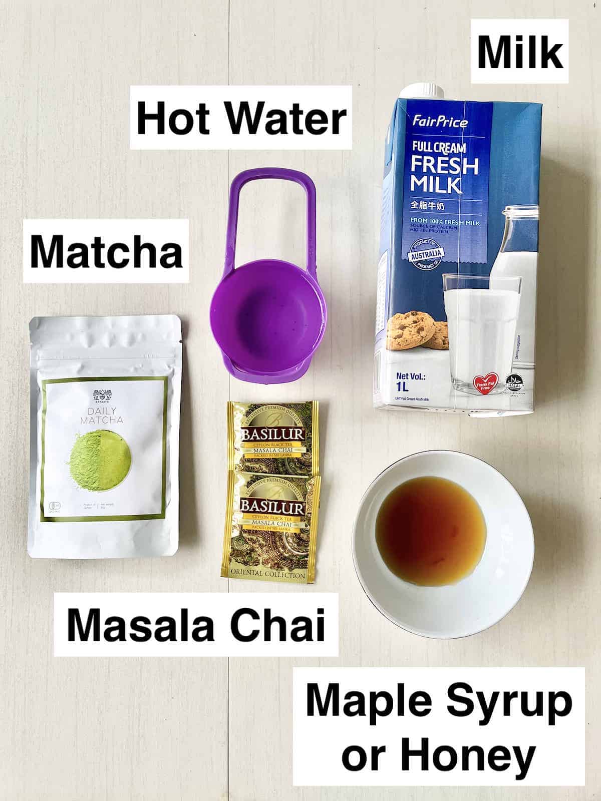 The 5 ingredients needed to make a Masala Chai Latte on a cream background.