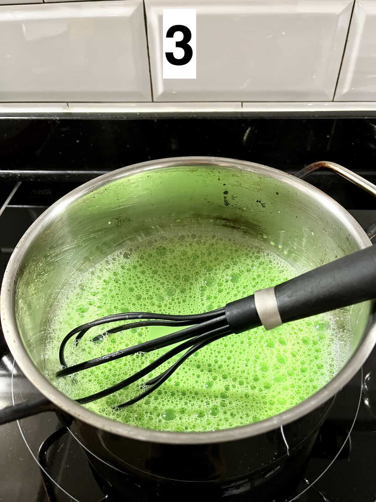 Whisking the green pandan steamed milk.