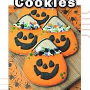 Close-up of Jack O Lantern decorated cookies with Text on top.